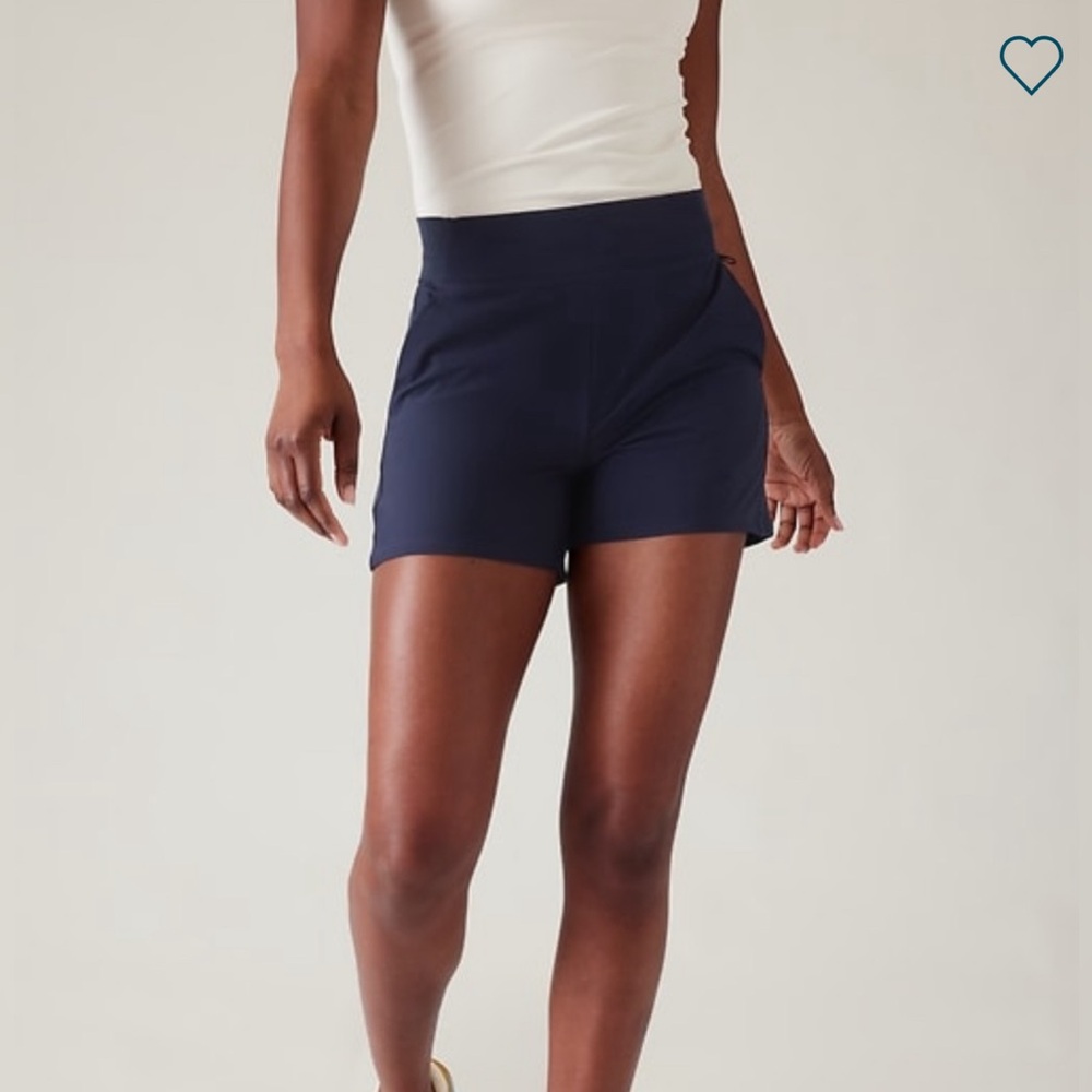 4 Pairs of Athleta Brooklyn shorts size 14 - 1 navy, 2 black 1 and teal.